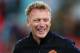 SYDNEY, AUSTRALIA - JULY 20: Manchester United manager, David Moyes shares a joke with a coaching staff at full time following the match between the A-League All-Stars and Manchester United at ANZ Stadium on July 20, 2013 in Sydney, Australia. (Photo by Brendon Thorne/Getty Images)