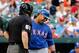 BALTIMORE, MD - JULY 10: Nelson Cruz #17 of the Texas Rangers questions home plate umpire Bill Welke after being called out looking for the third out of the first inning at Oriole Park at Camden Yards on July 10, 2013 in Baltimore, Maryland. (Photo by Rob Carr/Getty Images)