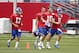 Jul 27, 2013; East Rutherford, NJ, USA; New York Giants quarterbacks Curtis Painter (17) David Carr (8) Eli Manning (10) and Ryan Nassib (9) lead team on to the field to begin training camp at the Timex Performance Center. Mandatory Credit: Jim O'Connor-USA TODAY Sports
