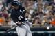 DETROIT, MI - JULY 9: Alex Rios #51 of the Chicago White Sox hits a single against the Detroit Tigers in the fifth inning at Comerica Park on July 9, 2013 in Detroit, Michigan. Rios went 6-for-6 at the plate in a 11-4 win over the Tigers. (Photo by Duane Burleson/Getty Images)