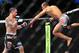 Feb 2, 2013; Las Vegas, NV, USA; Frankie Edgar (left) and Jose Aldo (right) battle each other during UFC 156 at the Mandalay Bay Events Center. Mandatory Credit: Gary A. Vasquez-USA TODAY Sports