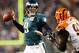 PHILADELPHIA, PA - DECEMBER 13: Nick Foles #9 of the Philadelphia Eagles passes under pressure from Robert Geathers #91 of the Cincinnati Bengals on December 13, 2012 at Lincoln Financial Field in Philadelphia, Pennsylvania. (Photo by Elsa/Getty Images)