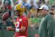 Jul 26, 2013; Green Bay, WI, USA; Green Bay Packers quarterback Aaron Rodgers works out with head coach Mike McCarthy during opening day of training camp at Nitschke Field. Mandatory Credit: Benny Sieu-USA TODAY Sports