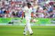 Khawaja walks back to the pavilion on a day of controversy