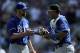 MINNEAPOLIS, MN - AUGUST 1: Louis Coleman #31 and Salvador Perez #13 of the Kansas City Royals celebrate a win of the game against the Minnesota Twins on August 1, 2013 at Target Field in Minneapolis, Minnesota. The Royals defeated the Twins 7-2. (Photo by Hannah Foslien/Getty Images)