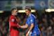 LONDON, ENGLAND - OCTOBER 28: Fernando Torres of Chelsea is helped to his feet by Wayne Rooney of Manchester United after being shown the red card during the Barclays Premier League match between Chelsea and Manchester United at Stamford Bridge on October 28, 2012 in London, England. (Photo by Michael Regan/Getty Images)