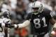 OAKLAND, CA - SEPTEMBER 28: Wide receiver Tim Brown #81 of the Oakland Raiders slaps a teammate's hand during a game against the San Diego Chargers on September 28, 2003 at Network Associates Coliseum in Oakland, California. The Raiders defeated the Chargers 34-31 in overtime. (Photo by Stephen Dunn/Getty Images)