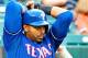 OAKLAND, CA - AUGUST 04: Nelson Cruz #17 of the Texas Rangers bats and flys out to centerfield in the ninth inning against the Oakland Athletics at O.co Coliseum on August 4, 2013 in Oakland, California. (Photo by Thearon W. Henderson/Getty Images)