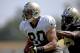 Jul 29, 2013; Metairie, LA, USA; New Orleans Saints tight end Jimmy Graham (80) runs from defensive end Martez Wilson (95) during a morning training camp practice at the team facility. Mandatory Credit: Derick E. Hingle-USA TODAY Sports