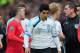 MANCHESTER, ENGLAND - FEBRUARY 11: Luis Suarez of Liverpool walks off for half time as Wayne Rooney of Manchester United talks to referee Phil Dowd during the Barclays Premier League match between Manchester United and Liverpool at Old Trafford on February 11, 2012 in Manchester, England. (Photo by Shaun Botterill/Getty Images)