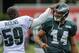 Aug 6, 2013; Philadelphia, PA, USA; Philadelphia Eagles linebacker DeMeco Ryans (59) greets Philadelphia Eagles wide receiver Riley Cooper (14) during NFL training camp at the NovaCare complex. Mandatory Credit: John Geliebter-USA TODAY Sports