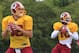Aug 5, 2013; Richmond, VA, USA; Washington Redskins quarterback Robert Griffin III (10) and Redskins quarterback Kirk Cousins (12) prepare to throw the ball during afternoon practice as part of the 2013 NFL training camp at the Bon Secours Washington Redskins Training Center. Mandatory Credit: Geoff Burke-USA TODAY Sports