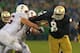 SOUTH BEND, IN - OCTOBER 13: Louis Nix III #9 of the Notre Dame Fighting Irish rushes against Kevin Danser #76 of the Standford Cardinal at Notre Dame Stadium on October 13, 2012 in South Bend, Indiana. Notre Dame defeated Stanford 20-13 in overtime. (Photo by Jonathan Daniel/Getty Images)