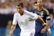 GLENDALE, AZ - AUGUST 01: Cristiano Ronaldo #7 of Real Madrid moves the ball past Marcelo Sarvas #8 of the Los Angeles Galaxy during the first half of the International Champions Cup match at University of Phoenix Stadium on August 1, 2013 in Glendale, Arizona. (Photo by Christian Petersen/Getty Images)