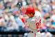 NEW YORK, NY - JULY 21: Chase Utley #26 of the Philadelphia Phillies follows through on a fourth inning base hit against the New York Mets at Citi Field on July 21, 2013 in the Flushing neighborhood of the Queens borough of New York City. (Photo by Jim McIsaac/Getty Images)
