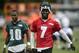 Jul 26, 2013; Philadelphia, PA, USA; Philadelphia Eagles quarterback Michael Vick (7) and wide receiver DeSean Jackson (10) walk off the field together at the end of practice during training camp at the Eagles NovaCare Complex. Mandatory Credit: Howard Smith-USA TODAY Sports