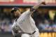 SAN DIEGO, CA - AUGUST 2: CC Sabathia #52 of the New York Yankees pitches during the first inning of a baseball game against the San Diego Padres at Petco Park on August 2, 2013 in San Diego, California. (Photo by Denis Poroy/Getty Images)
