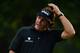 ROCHESTER, NY - AUGUST 08: Phil Mickelson of the United States reacts on the 17th hole during the first round of the 95th PGA Championship on August 8, 2013 in Rochester, New York. (Photo by Stuart Franklin/Getty Images)