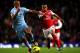 MANCHESTER, ENGLAND - DECEMBER 18: Vincent Kompany of Manchester City competes with Theo Walcott of Arsenal during the Barclays Premier League match between Manchester City and Arsenal at the Etihad Stadium on December 18, 2011 in Manchester, England. (Photo by Alex Livesey/Getty Images)