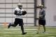 May 30, 2013; New Orleans, LA, USA; New Orleans Saints running back Mark Ingram (22) runs past head coach Sean Payton during organized team activities at the Saints training facility. Mandatory Credit: Derick E. Hingle-USA TODAY Sports