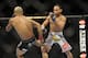 Jan 26, 2013; Chicago, IL, USA; Demetrious Johnson (black shorts) fights John Dodson (white shorts) during UFC on FOX 6 for the world flyweight championship at the United Center. Mandatory Credit: David Banks-USA TODAY Sports