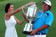 Jason Dufner and his wife hold the Wanamaker Trophy.