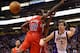 PHOENIX, AZ - JANUARY 24: Goran Dragic #1 of the Phoenix Suns passes the ball around Eric Bledsoe #12 of the Los Angeles Clippers during the NBA game at US Airways Center on January 24, 2013 in Phoenix, Arizona. The Suns defeated the Clippers 93-88. NOTE TO USER: User expressly acknowledges and agrees that, by downloading and or using this photograph, User is consenting to the terms and conditions of the Getty Images License Agreement. (Photo by Christian Petersen/Getty Images)