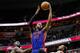 WASHINGTON, DC - FEBRUARY 27: Greg Monroe #10 of the Detroit Pistons puts up a shot between Emeka Okafor #50 (L) and A.J. Price #12 of the Washington Wizards during the first half at Verizon Center on February 27, 2013 in Washington, DC. NOTE TO USER: User expressly acknowledges and agrees that, by downloading and or using this photograph, User is consenting to the terms and conditions of the Getty Images License Agreement. (Photo by Rob Carr/Getty Images)