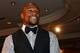 LAS VEGAS, NV - AUGUST 10: Boxer Floyd Mayweather Jr. watches a video as he accepts the award for Male Fighter of the Year from Nevada at the Nevada Boxing Hall of Fame inaugural induction gala at the Monte Carlo Resort and Casino on August 10, 2013 in Las Vegas, Nevada. (Photo by Ethan Miller/Getty Images)