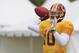 Aug 13, 2013; Richmond, VA, USA; Washington Redskins quarterback Robert Griffin III (10) throws the ball during afternoon practice as part of the 2013 NFL training camp at the Bon Secours Washington Redskins Training Center. Mandatory Credit: Geoff Burke-USA TODAY Sports