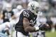 Aug 9, 2013; Oakland, CA, USA; Oakland Raiders running back Darren McFadden (20) catches a pass from quarterback Matt Flynn (15) during the first quarter of the game against the Dallas Cowboys at O.Co Coliseum. Mandatory Credit: Ed Szczepanski-USA TODAY Sports