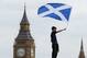 LONDON, ENGLAND - AUGUST 14: A boy waves a flag as Scotland fans gather in Trafalgar Square ahead of their friendly match against England tonight on August 14, 2013 in London, England. Scotland and England will meet at Wembley stadium tonight for their first international in 14 years. (Photo by Dan Kitwood/Getty Images)