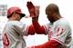 SAN FRANCISCO, CA - MAY 08: Michael Young #10 of the Philadelphia Phillies is congratulated by Jimmy Rollins #11 after Young scored the tying run against the San Francisco Giants in the ninth inning at AT&T Park on May 8, 2013 in San Francisco, California. Young made the score 3-3 on a Delmon Young sacrifice fly. (Photo by Thearon W. Henderson/Getty Images)