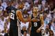 MIAMI, FL - JUNE 18: Tim Duncan #21 and Tony Parker #9 of the San Antonio Spurs celebrate in the third quarter while taking on the Miami Heat during Game Six of the 2013 NBA Finals at AmericanAirlines Arena on June 18, 2013 in Miami, Florida. NOTE TO USER: User expressly acknowledges and agrees that, by downloading and or using this photograph, User is consenting to the terms and conditions of the Getty Images License Agreement. (Photo by Mike Ehrmann/Getty Images)