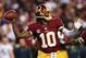 LANDOVER, MD - JANUARY 06: Robert Griffin III #10 of the Washington Redskins drops back to pass against the Seattle Seahawks during the NFC Wild Card Playoff Game at FedExField on January 6, 2013 in Landover, Maryland. (Photo by Win McNamee/Getty Images)