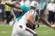 HOUSTON, TX- SEPTEMBER 09: Owen Daniels #81 of the Houston Texans is tackled by Karlos Dansby #58 of the Miami Dolphins during the season opener at Reliant Stadium on September 9, 2012 in Houston, Texas. (Photo by Thomas B. Shea/Getty Images)