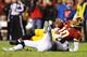 LANDOVER, MD - JANUARY 06: Robert Griffin III #10 of the Washington Redskins is sacked during the NFC Wild Card Playoff Game against the Seattle Seahawks at FedExField on January 6, 2013 in Landover, Maryland. (Photo by Al Bello/Getty Images)