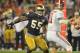 Jan 7, 2013; Miami, FL, USA; Notre Dame Fighting Irish linebacker Prince Shembo (55) chases Alabama Crimson Tide quarterback A.J. McCarron (10) during the first half of the 2013 BCS Championship game at Sun Life Stadium. Mandatory Credit: Matt Cashore-USA TODAY Sports