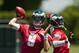 Jun 4, 2013; Philadelphia, PA, USA; Philadelphia Eagles quarterback Nick Foles (9) and quarterback Michael Vick (7) pass the ball during minicamp at the NovaCare Complex. Mandatory Credit: Howard Smith-USA TODAY Sports