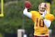 Aug 13, 2013; Richmond, VA, USA; Washington Redskins quarterback Robert Griffin III (10) throws the ball during afternoon practice as part of the 2013 NFL training camp at the Bon Secours Washington Redskins Training Center. Mandatory Credit: Geoff Burke-USA TODAY Sports