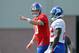 Aug 7, 2013; East Rutherford, NJ, USA; New York Giants quarterback Eli Manning (10) calls out signals in front of running back David Wilson (22) during team practice at the Quest Diagnostics Training Center. Mandatory Credit: Brad Penner-USA TODAY Sports