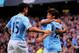 MANCHESTER, ENGLAND - AUGUST 19: David Silva of Manchester City celebrates with teammate Jesus Navas (L) after scoring the opening goal during the Barclays Premier League match between Manchester City and Newcastle United at the Etihad Stadium on August 19, 2013 in Manchester, England. (Photo by Michael Regan/Getty Images)
