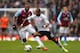 BIRMINGHAM, ENGLAND - APRIL 13: Eyong Enoh of Fulham is closely watched by Darren Bent of Aston Villa during the Barclays Premier League match between Aston Villa and Fulham at Villa Park on April 13, 2013 in Birmingham, England. (Photo by Shaun Botterill/Getty Images)
