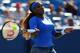 CINCINNATI, OH - AUGUST 18: Serena Williams returns a shot to Victoria Azarenka of Belarus in the Women's Singles final match during the Western & Southern Open on August 18, 2013 at Lindner Family Tennis Center in Cincinnati, Ohio. (Photo by Ronald Martinez/Getty Images)