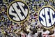Dec 1, 2012; Atlanta, GA, USA; Alabama Crimson Tide wide receiver DeAndrew White (2) holds the SEC sign after winning the 2012 SEC Championship game against the Georgia Bulldogs at the Georgia Dome. Alabama won 32-28. Mandatory Credit: Daniel Shirey-USA TODAY Sports
