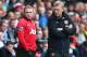 SWANSEA, WALES - AUGUST 17: David Moyes (R) the manager of Manchester United passes on final instructions as Wayne Rooney (L) comes on as a substitute during the Barclays Premier League match between Swansea City and Manchester United at the Liberty Stadium on August 17, 2013 in Swansea, Wales. (Photo by Michael Steele/Getty Images)