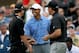 SAN DIEGO - JUNE 12: Tiger Woods (C) smiles as he greets Adam Scott of Australia (L) and Phil Mickelson (R) on the first tee before starting their first round of the 108th U.S. Open at the Torrey Pines Golf Course (South Course) on June 12, 2008 in San Diego, California. Woods shakes Scott's left hand due to an injury on the right hand of Scott. (Photo by Doug Pensinger/Getty Images)