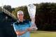 FARMINGDALE, NY - AUGUST 26: Nick Watney celebrates with the trophy after he won the tournament following the final round of The Barclays at the Black Course at Bethpage State Park August 26, 2012 in Farmingdale, New York. (Photo by Kevin C. Cox/Getty Images)