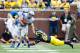 September 8, 2012; Ann Arbor, MI, USA; Air Force Falcons defensive back Anthony LaCoste (37) avoids Michigan Wolverines wide receiver Amara Darboh (82) at Michigan Stadium. Mandatory Credit: Rick Osentoski-USA TODAY Sports