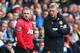SWANSEA, WALES - AUGUST 17: David Moyes (R) the manager of Manchester United passes on final instructions as Wayne Rooney (L) comes on as a substitute during the Barclays Premier League match between Swansea City and Manchester United at the Liberty Stadium on August 17, 2013 in Swansea, Wales. (Photo by Michael Steele/Getty Images)
